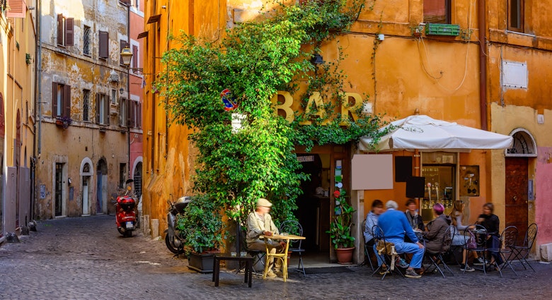 Cozy old street with a bar in Trastevere, on the west bank of the Tiber in Rome.
676279021
ambience, building, cafe, chairs, city, comfortable, cozy, dinner, europe, european, food, green, house, italia, italian, italy, lamp, lazio, old, outdoor, plant, restaurant, roma, roman, rome, rome cafe, rome cityscape, rome italy, rome restaurant, rome street, small, street, table, terrace, trastevere, tree, wall